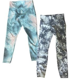 Athleta Elation printed leggings sold together or separate.